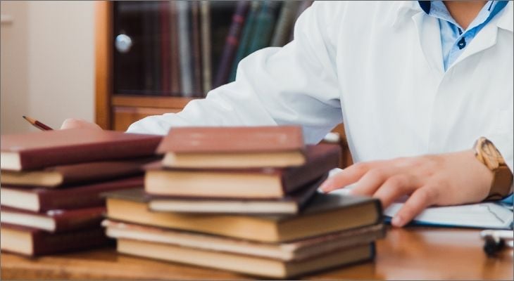 doctor with books